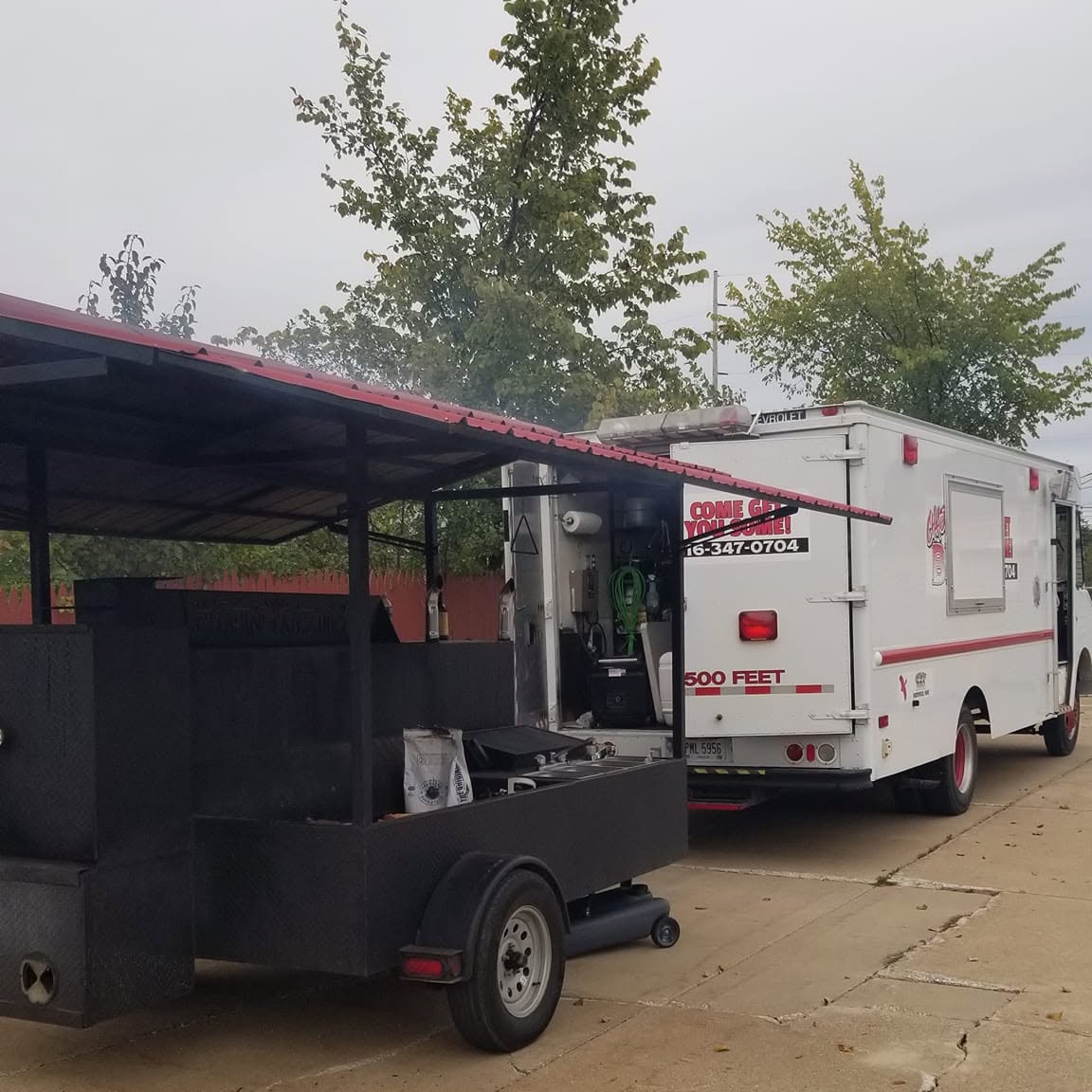 Chasin Tailz BBQ trailer and mobile smoker at an event